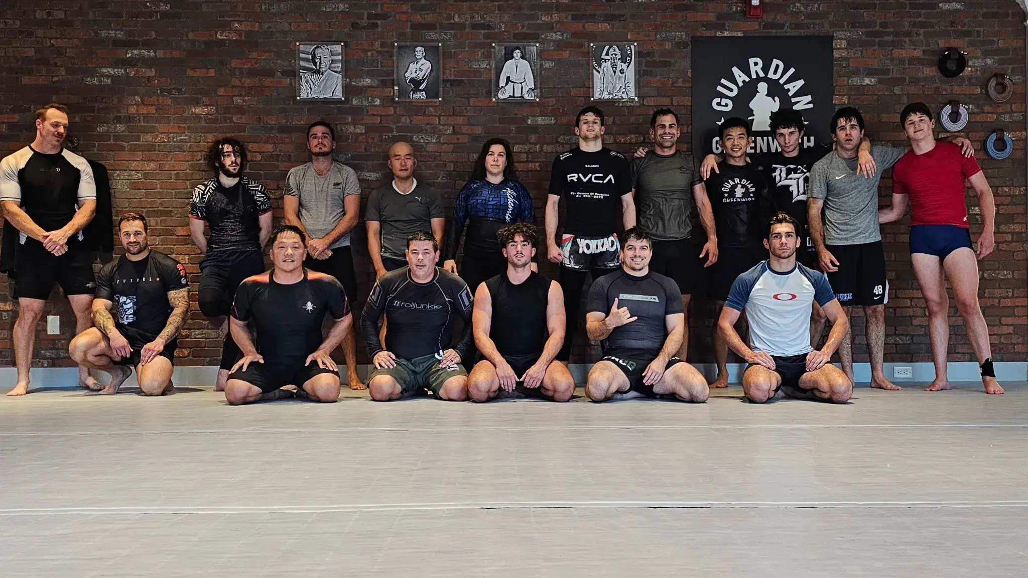 Coach Nick with jiu jitsu students from his training community
