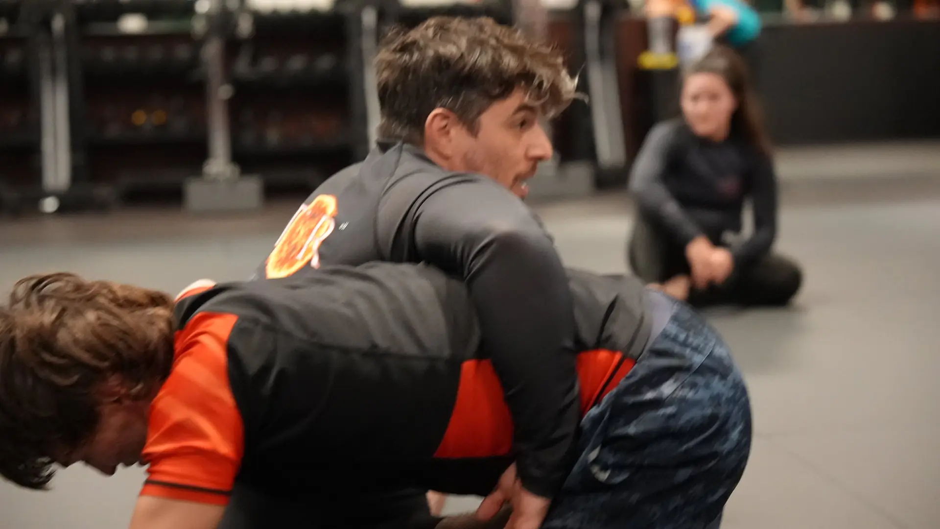 Training partners practicing no-gi jiu jitsu with Coach Nick